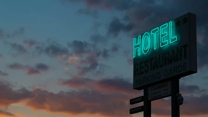 Hotel green neon sign in the night