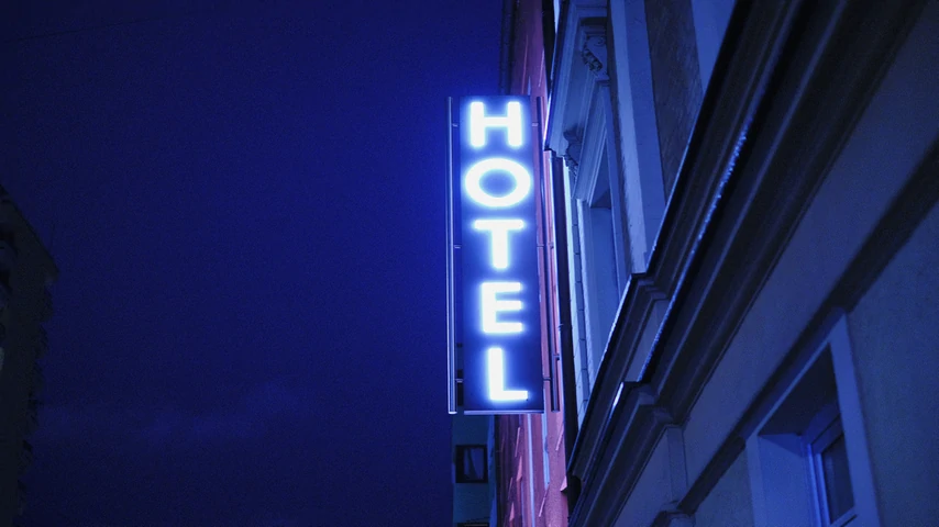 Hotel neon blue sign in the night